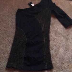 Black with gold sparkles! it’s a shirt.